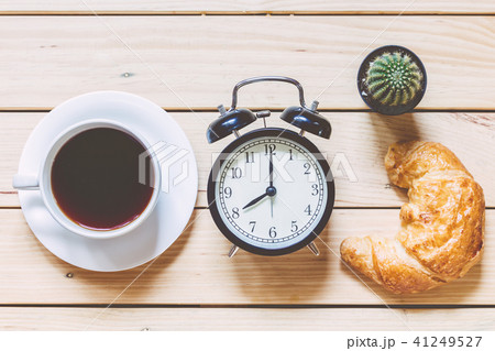 Cup with coffee on wooden table  41249527