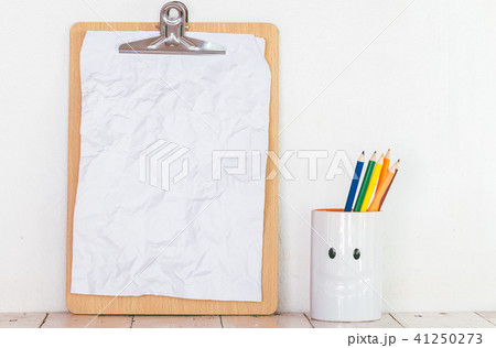 Paper in clipboard  on wooden table 41250273