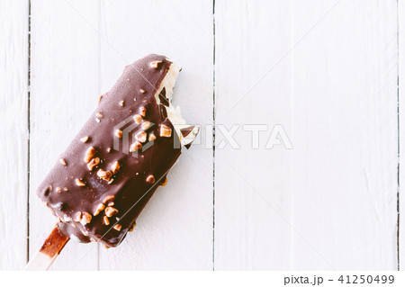 Bite Ice cream chocolate on wooden background 41250499