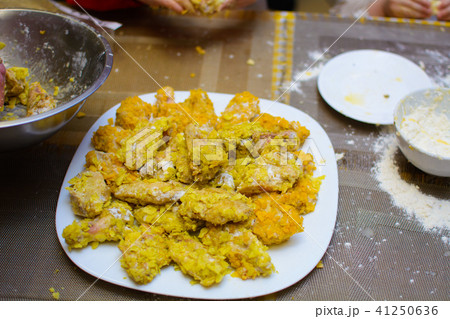 a lot of fried chicken wings in a white plate 41250636