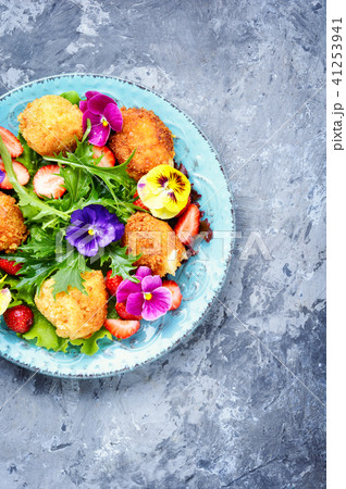Salad leaves with strawberries,herbs and flowers Salad leaves with strawberries,herbs and flowers 41253941
