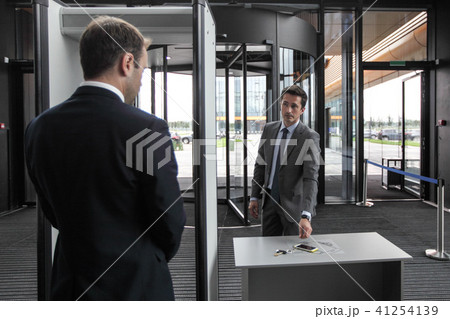 Man at airport security gates Man at airport security gates 41254139