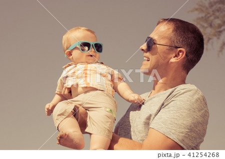 Father and baby son playing on the beach at the day time. 41254268