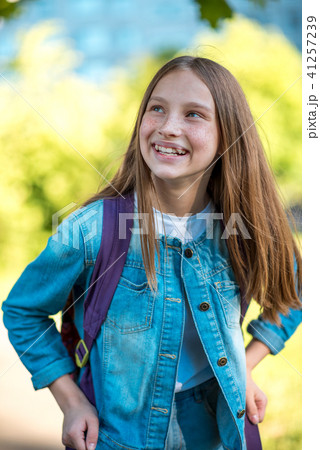Beautiful teenager girl happy smiling looking up. Emotions of happiness and joy of life. In summer 41257239