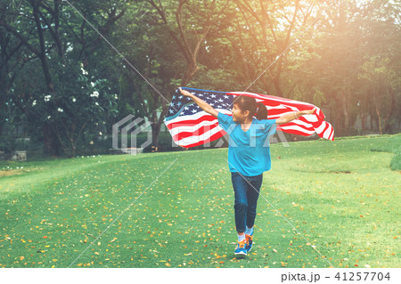 Happy kid little child running with American flag 41257704