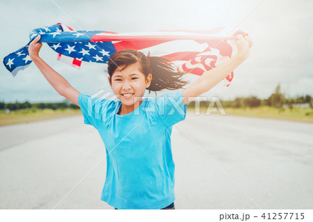 Happy kid little child running with American flag 41257715
