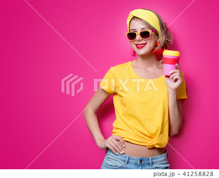 Girl holding a red cup of coffee 41258828
