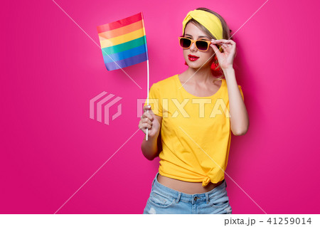 girl holding big LGBT flag girl holding big LGBT flag 41259014