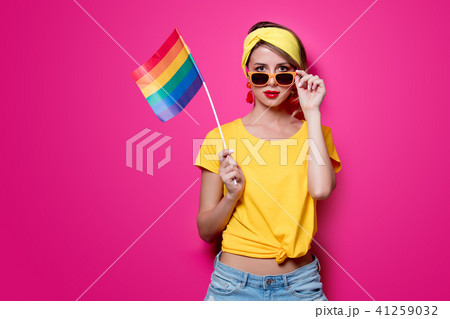 girl holding big LGBT flag girl holding big LGBT flag 41259032