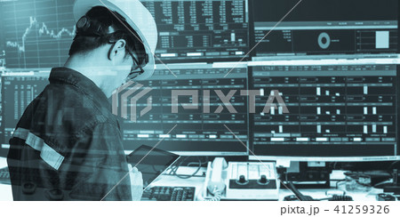 Double exposure of engineer man holding tablet 41259326