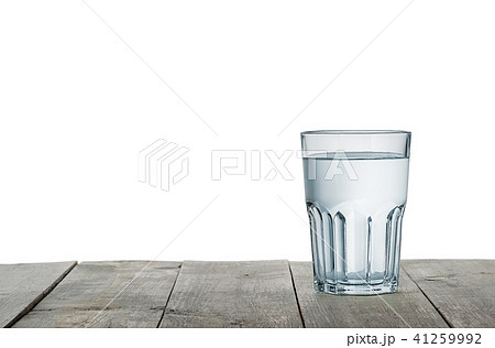 Glass of water on wooden table 41259992