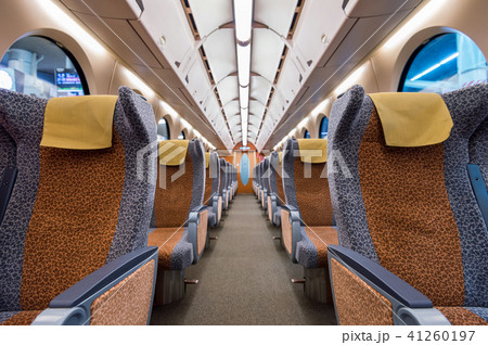Interior of a train with empty seats.  41260197