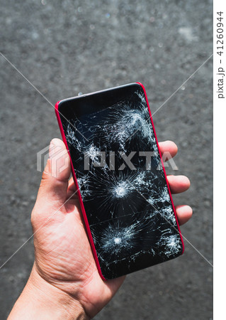 Person holding broken smartphone 41260944