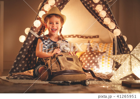funny child girl tourist with flashlight and world map and backp 41265951