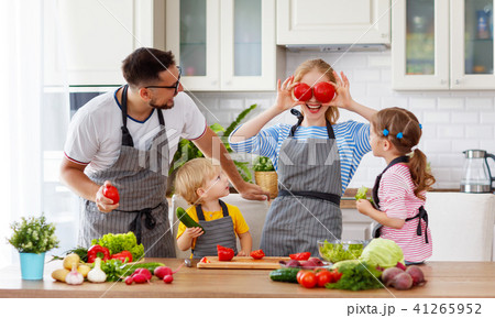 happy family with children preparing vegetable salad . 41265952