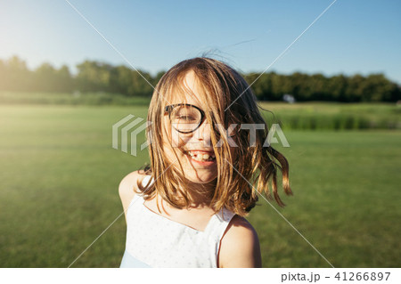 Portrait of pretty smiling girl in glasses. 41266897