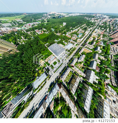 Aerial city view with crossroads and roads, houses, buildings, parks and parking lots. Sunny summer Aerial city view with crossroads and roads, houses, buildings, parks and parking lots. Sunny summer 41272153