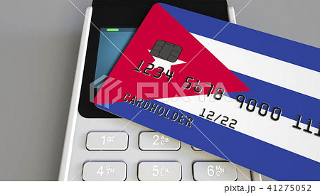 Payment or POS terminal with credit card featuring flag of Cuba. Cuban retail commerce or banking 41275052