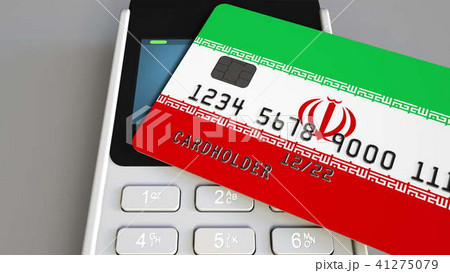 Payment or POS terminal with credit card featuring flag of Iran. Iranian retail commerce or banking 41275079