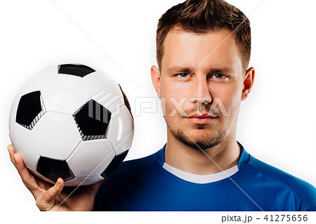 Close-up portrait of young handsome football player soccer posing on white isolated. 41275656