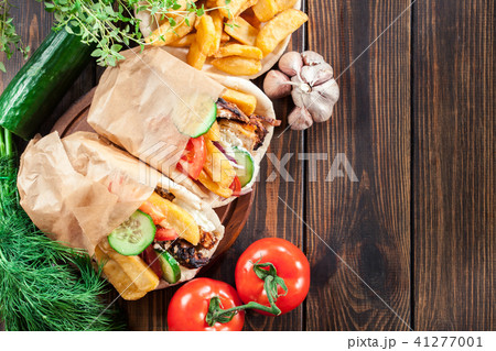 Gyros souvlaki wrapped in a pita bread 41277001