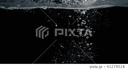 Soda water splashing drop in black background Soda water splashing drop in black background 41279528