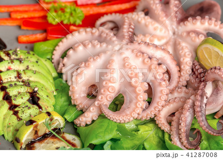 close up of octopus served with sliced avocado close up of octopus served with sliced avocado 41287008