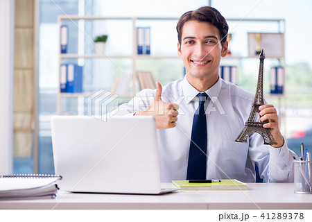 Sales agent working in travel agency 41289378