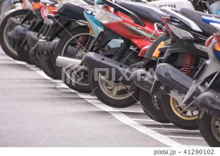 A row of motorcycle parking along the roadside 41290102