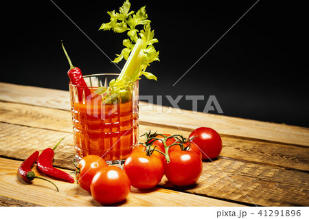 bloody mary with a piece of green celery and chilli peppers and tomatoes bloody mary with a piece of green celery and chilli peppers and tomatoes 41291896