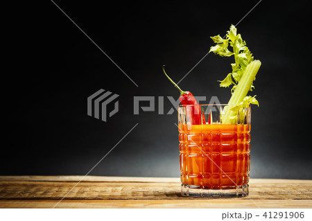 bloody mary with a piece of green celery and chilli peppers bloody mary with a piece of green celery and chilli peppers 41291906