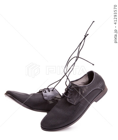 A pair of men's shoes with perforations 41293570