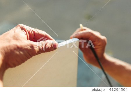 Close up man working of Architect sketching a construction project on his plane project at site Close up man working of Architect sketching a construction project on his plane project at site 41294504