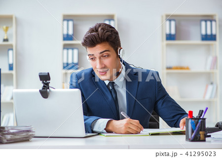 Young help desk operator working in office 41295023