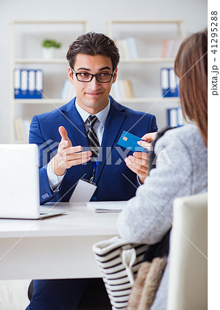 Woman makes payment with credit card Woman makes payment with credit card 41295288