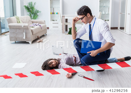 Forensic investigator at the crime scene investigating woman mur 41296256