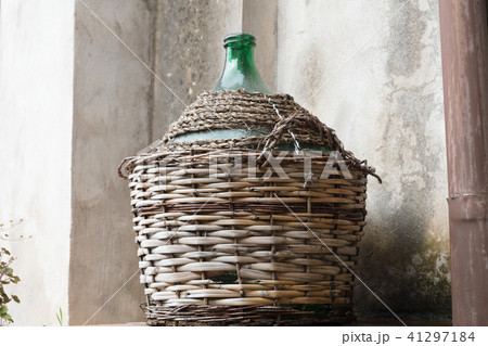 Empty carboy in rustic house 41297184