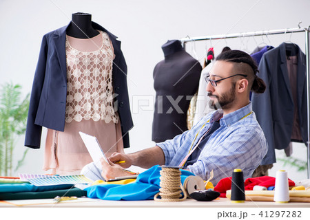 Male tailor working in the workshop on new designs 41297282