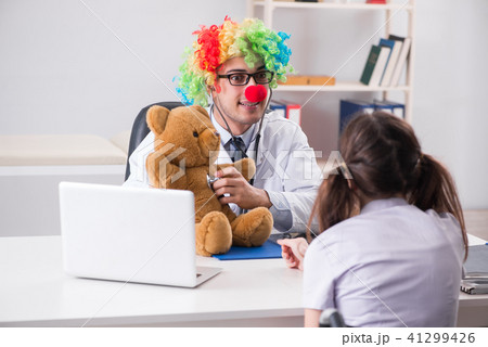Funny pediatrician with little girl at regular check-up 41299426