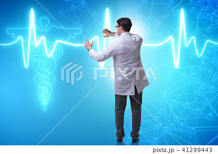 Telemedicine concept with doctor pressing virtual buttons Telemedicine concept with doctor pressing virtual buttons 41299443