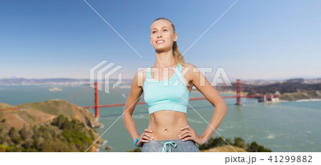 woman in sports clothes over golden gate bridge woman in sports clothes over golden gate bridge 41299882
