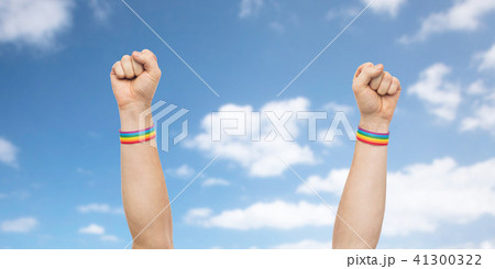 hands with gay pride rainbow wristbands shows fist hands with gay pride rainbow wristbands shows fist 41300322