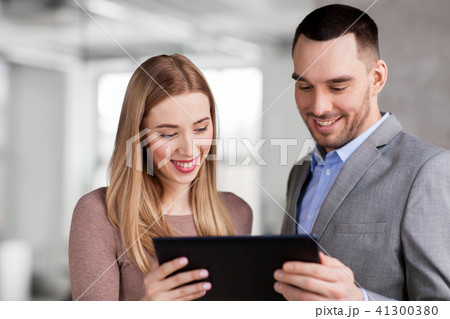 businesswoman and businessman with tablet pc 41300380