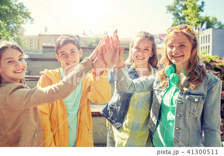 happy students or friends making high five 41300511