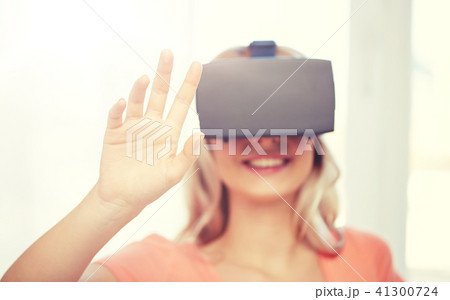 woman in virtual reality headset or 3d glasses woman in virtual reality headset or 3d glasses 41300724