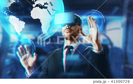 businessman in virtual reality headset with earth 41300729