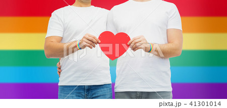 couple with gay pride rainbow wristbands and heart 41301014