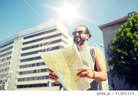man traveling with backpack and map in city 41301151