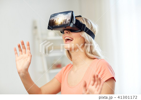 woman in virtual reality headset or 3d glasses woman in virtual reality headset or 3d glasses 41301172