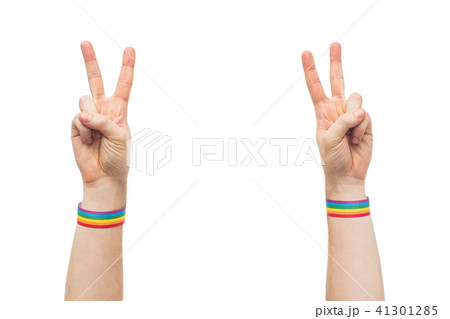 hands with gay pride rainbow wristbands make peace 41301285